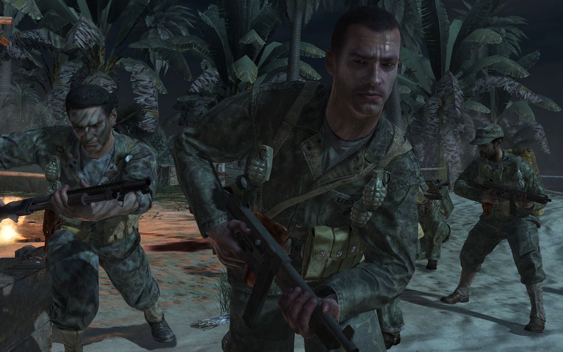 Screenshot from Call of Duty: World at War video game of soldiers running on a beach in jungle setting.