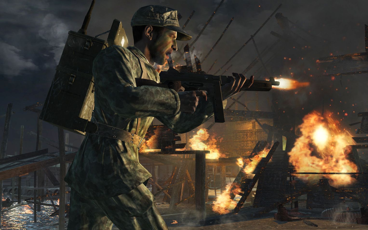 Screenshot from Call of Duty: World at War video game of soldier firing assault rifle while running into battle.