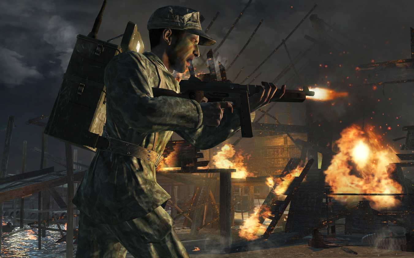Screenshot from Call of Duty: World at War video game of soldier firing assault rifle while running into battle.
