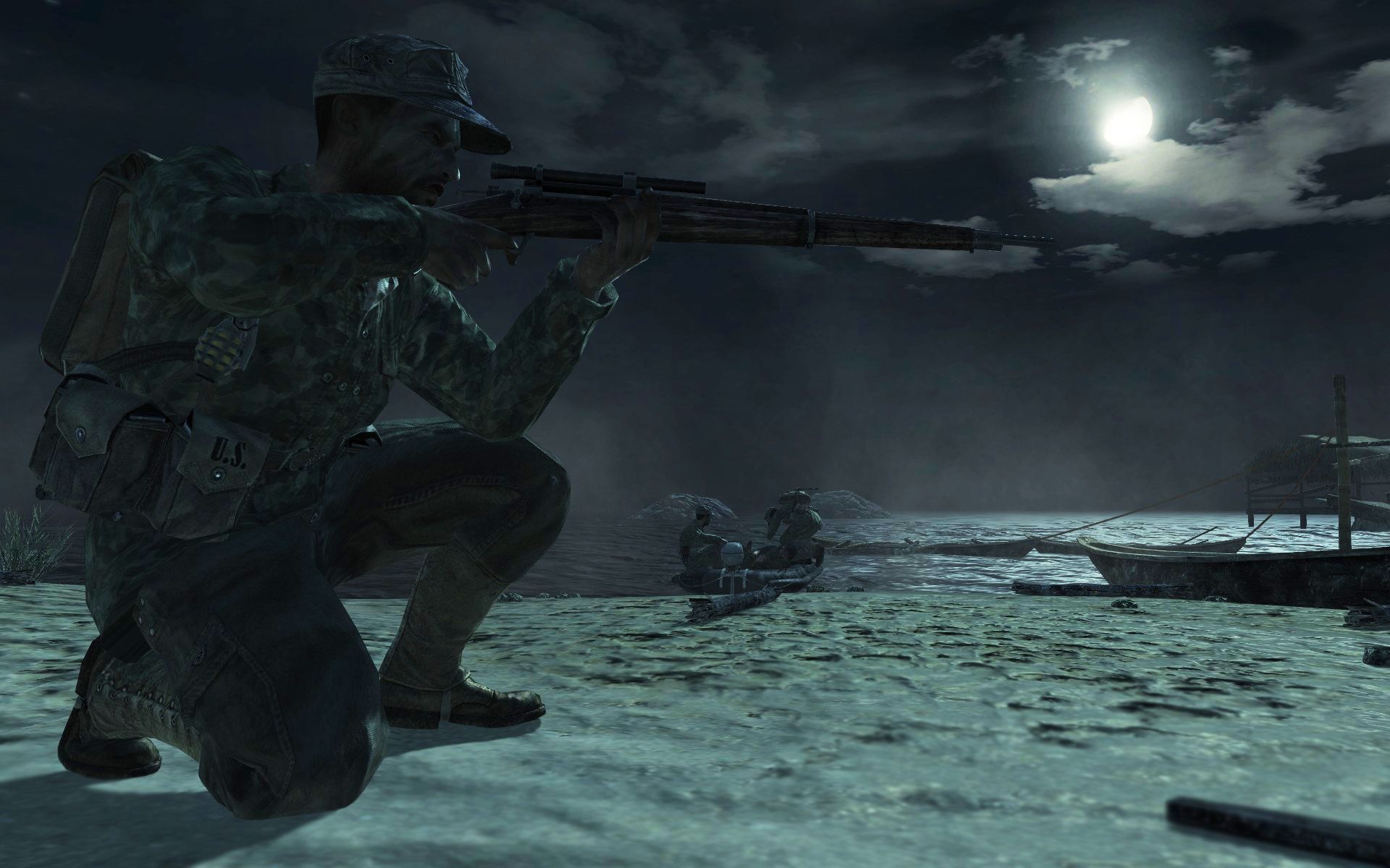 Screenshot from Call of Duty: World at War video game of soldier aiming a rifle at night.