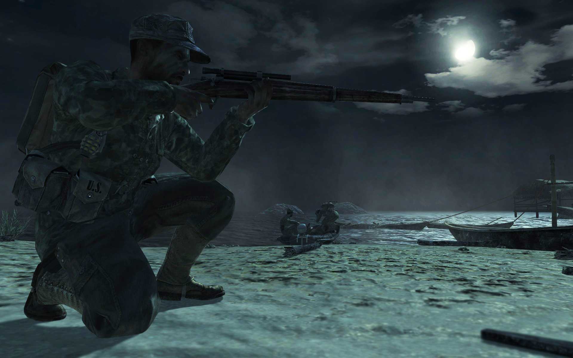 Screenshot from Call of Duty: World at War video game of soldier aiming a rifle at night.