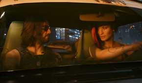 An image from Cyberpunk 2077, showing Johnny Silverhand and V sitting in a car.