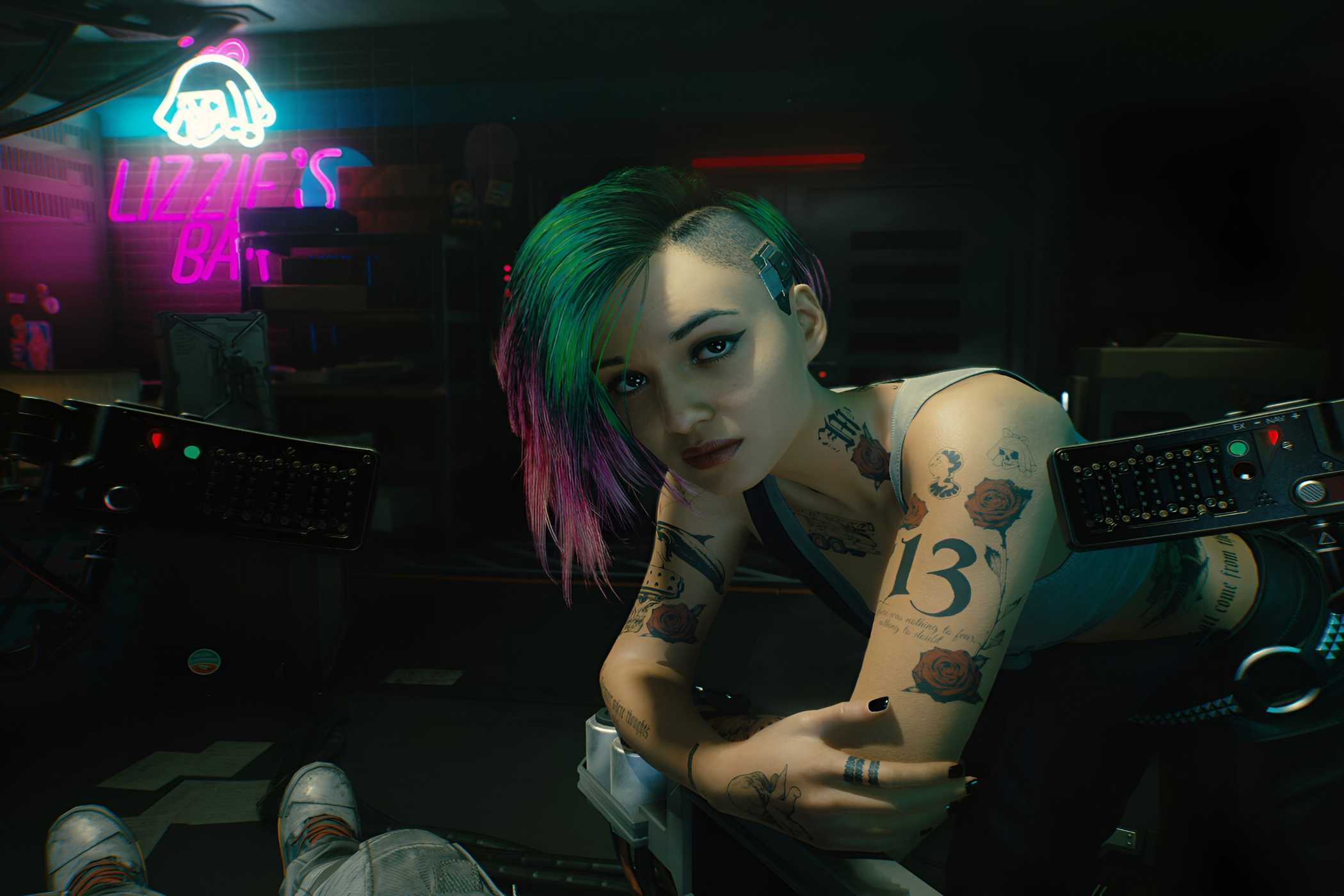 An image from Cyberpunk 2077, showing Judy Alvarez leaning over the protagonist.