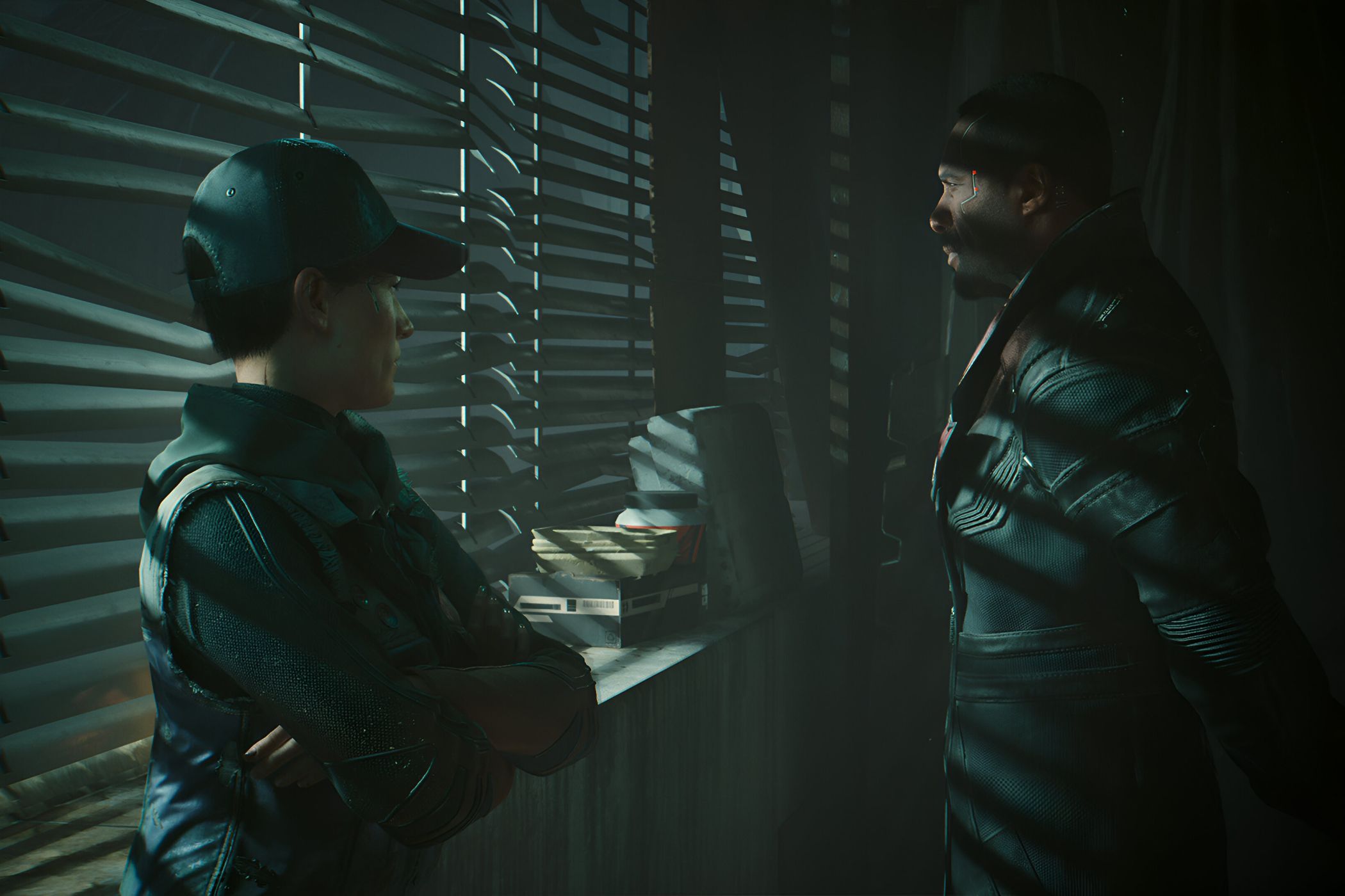 An image from Cyberpunk 2077, showing two characters standing next to a window with the blinds drawn.