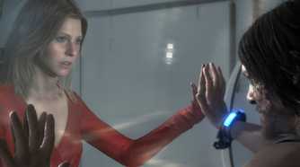 An image from the game "Death Stranding", showing a man and a woman facing each other with a glass wall between them.
