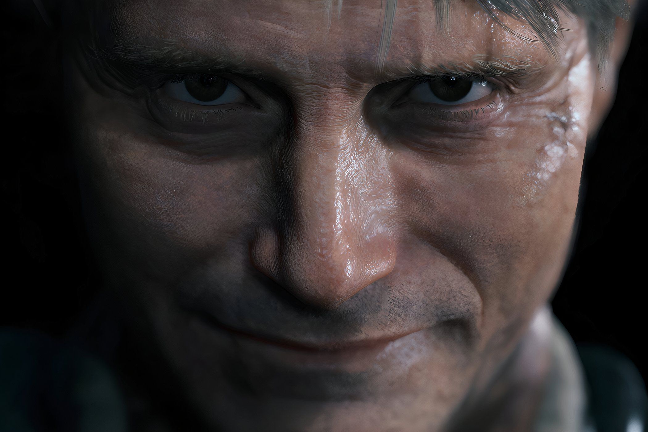 An image from the game "Death Stranding", showing a man staring into the camera with a smile on their face.