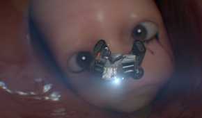 An image from the game "Death Stranding 2: On the Beach", showing a baby in a womb.