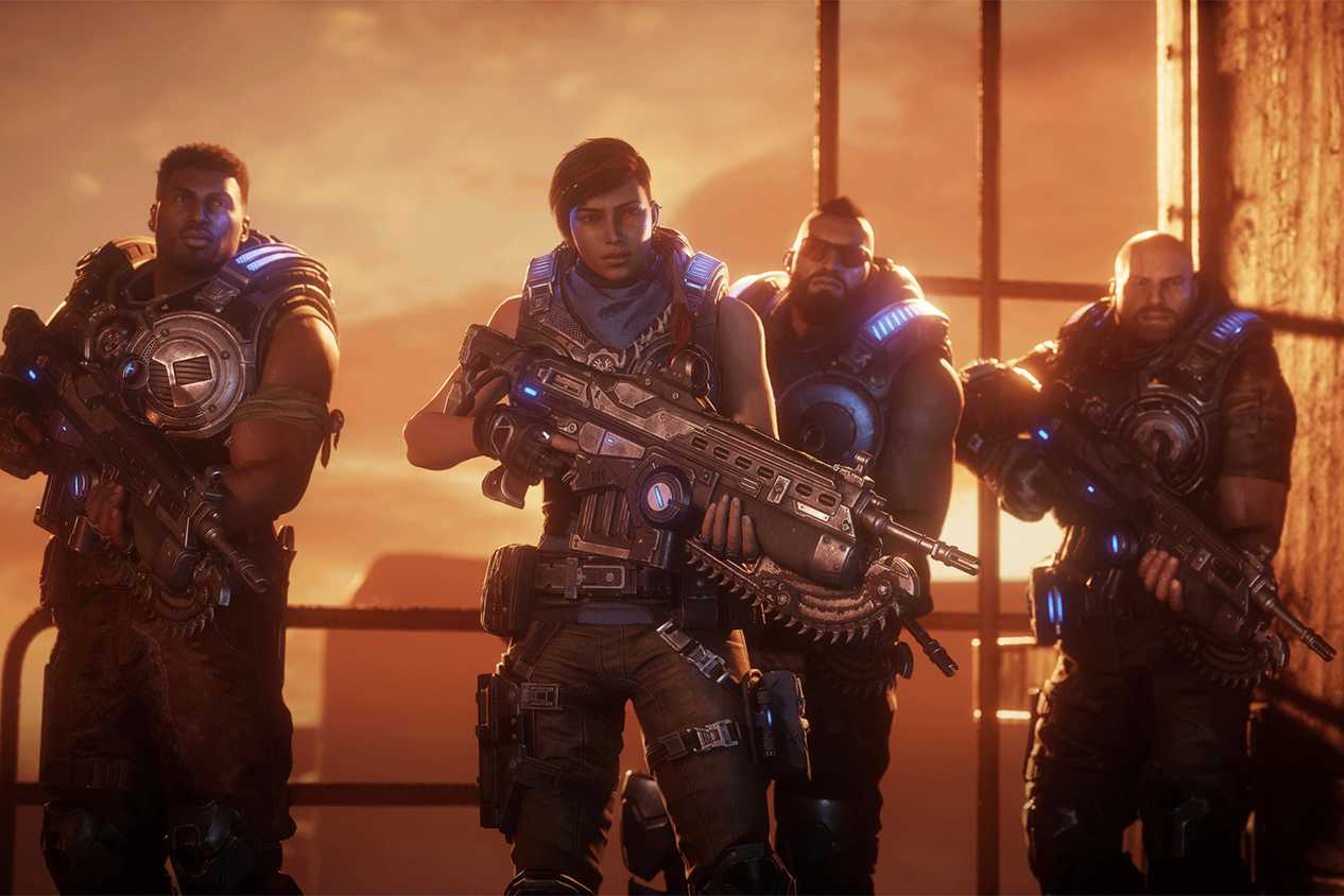 An image from the game Gears 5, showing the characters Kait Diaz, Delmont Walker, JD Fenix, and Fahz Chutani.