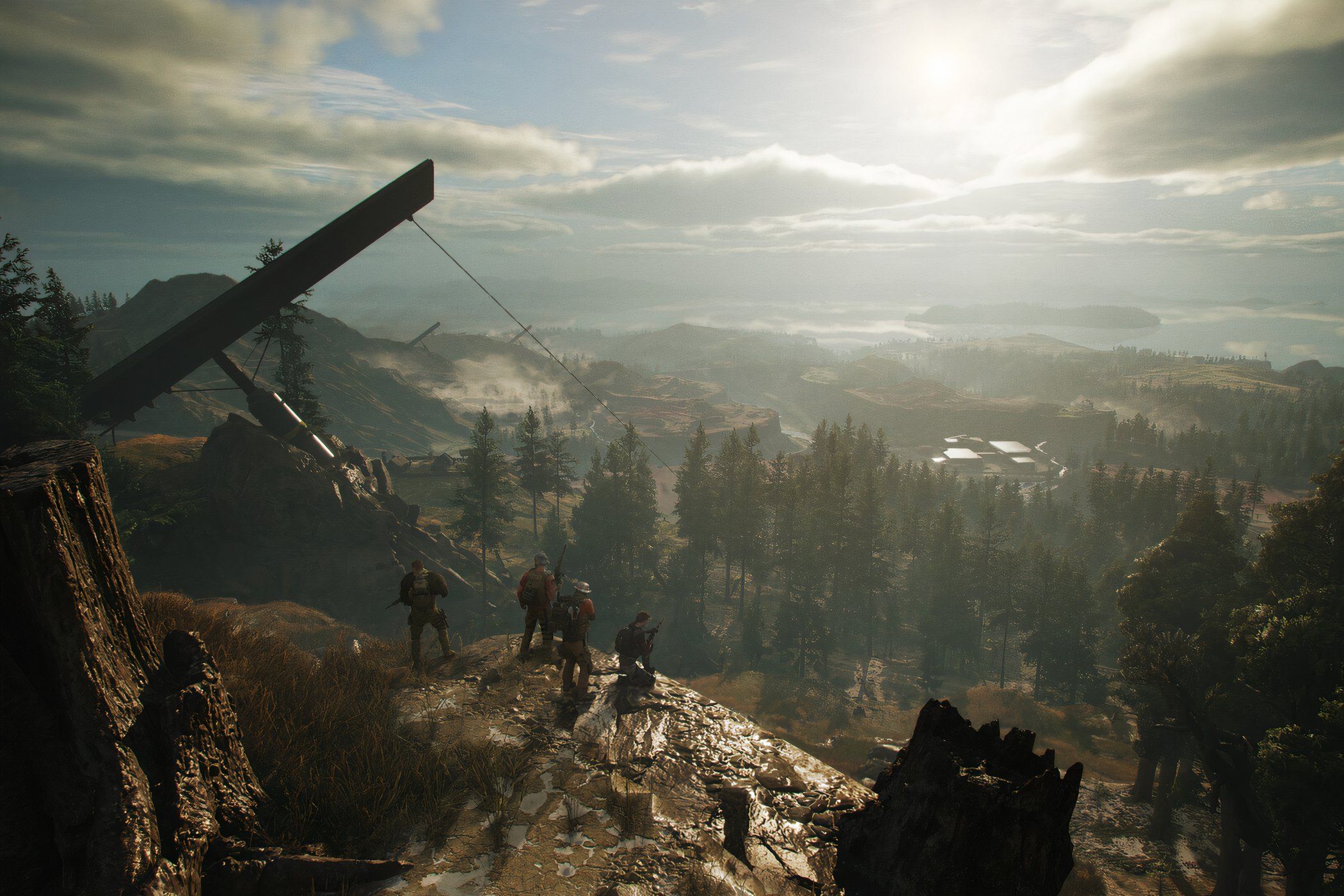 An image from Ghost Recon Breakpoint, showing four people sitting on a cliff.