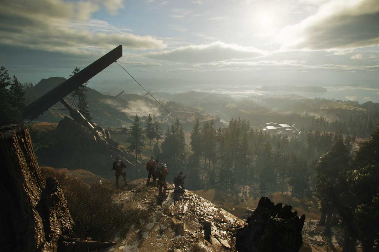 An image from Ghost Recon Breakpoint, showing four people sitting on a cliff.