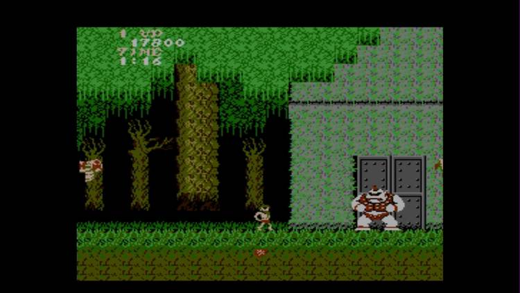 Fighting a boss in Ghosts 'N Goblins