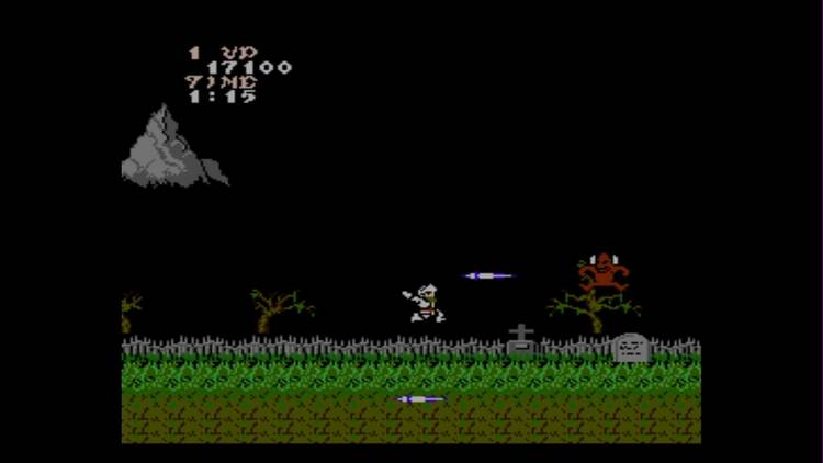 Fighting a red devil in Ghosts N' Goblins