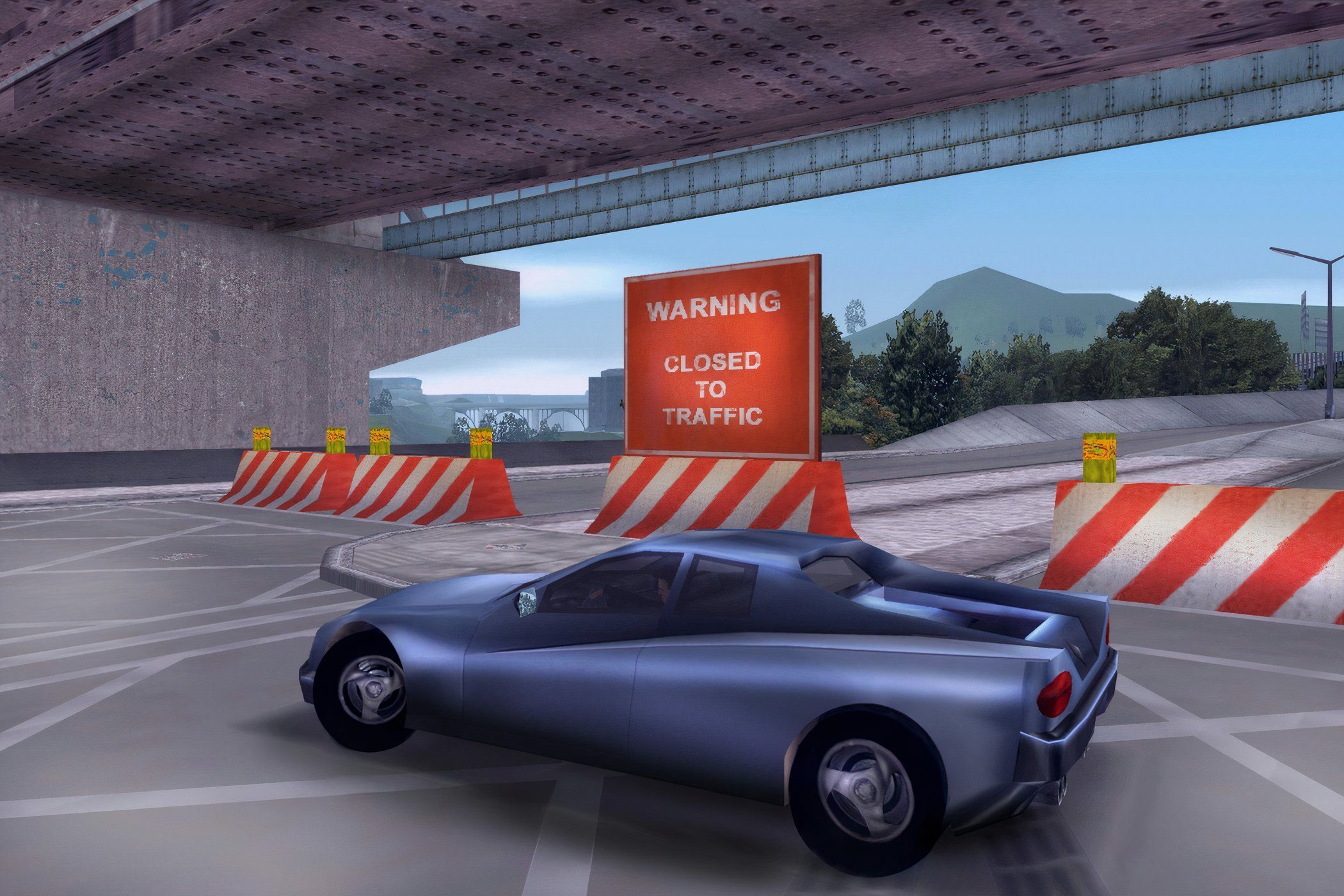 An image from the 2001 game, Grand Theft Auto III, showing a blue car on the road.