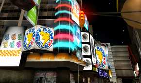 An image from the 2001 game, Grand Theft Auto III, showing a brightly-lit city street at night.