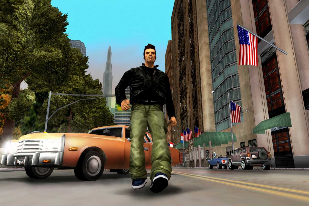 An image from the 2001 game, Grand Theft Auto III, showing a man in a black jacket walk down a road with a yellow cab behind him.