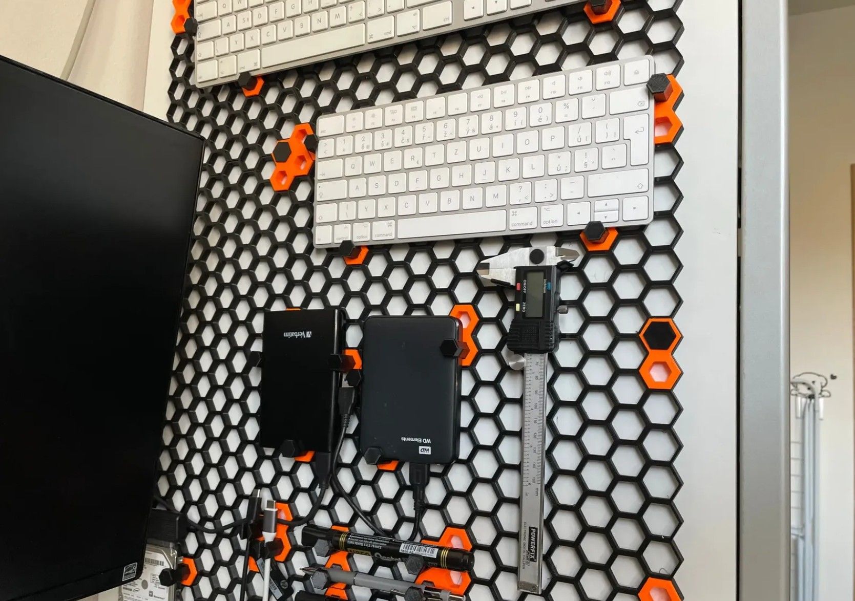 Honeycomb storage wall with things attached to it