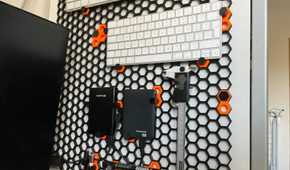 Honeycomb storage wall with things attached to it