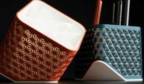 Two Kumiko pen holders of different colors