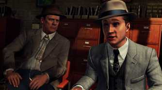 Screenshot from LA Noire video game of two men in 1940's US attire in office room talking.