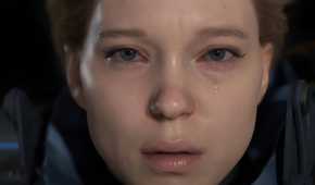 An image from the game "Death Stranding", showing actress Lea Seydoux as Fragile, staring into the camera as a teardrop rolls down her face.