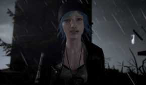 An image from the game Life is Strange, showing a blue-haired girl wearing a beanie and a jacket looking emotional as rain pours down around her.