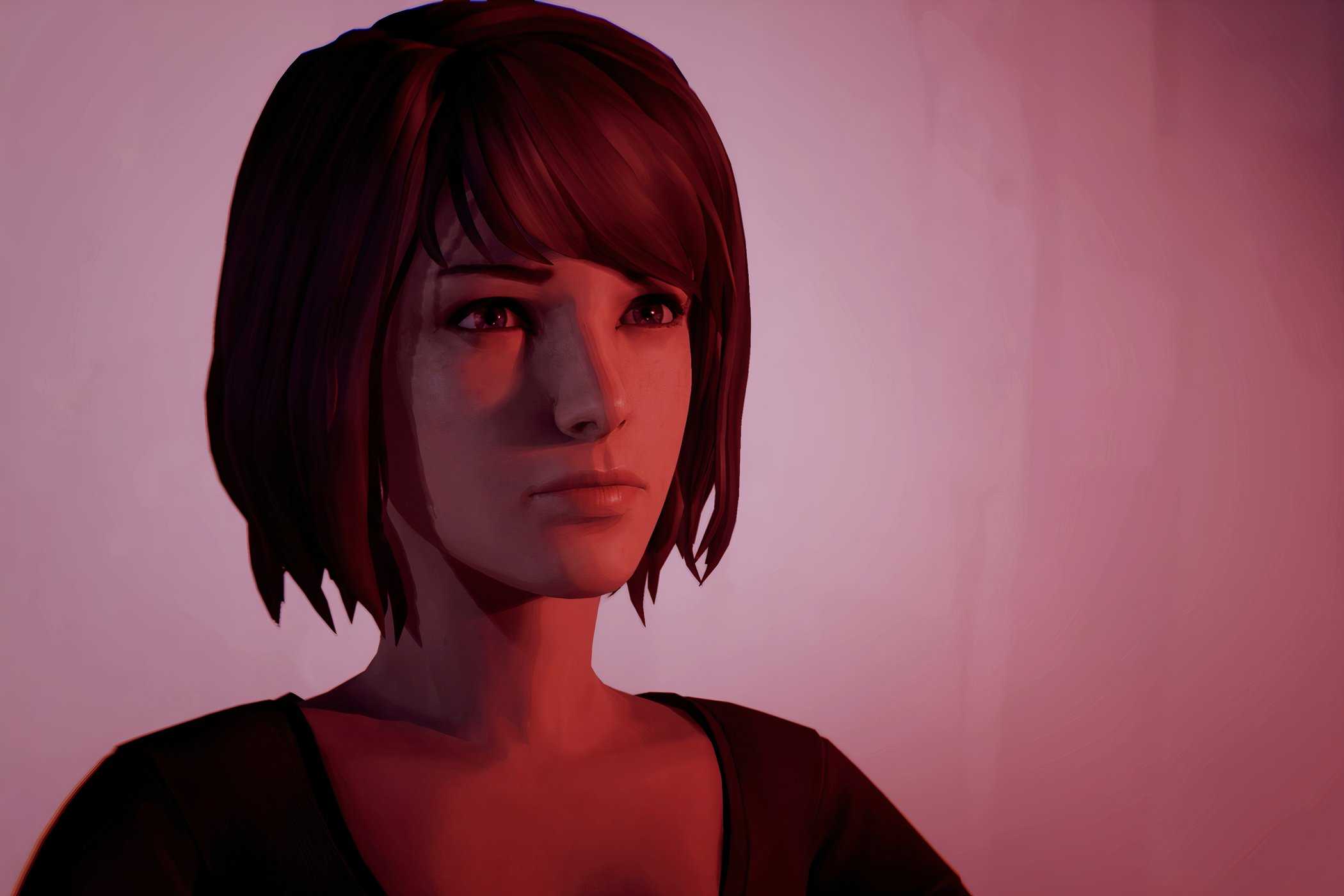 An image from the game Life is Strange, showing a girl bathed in pink light.