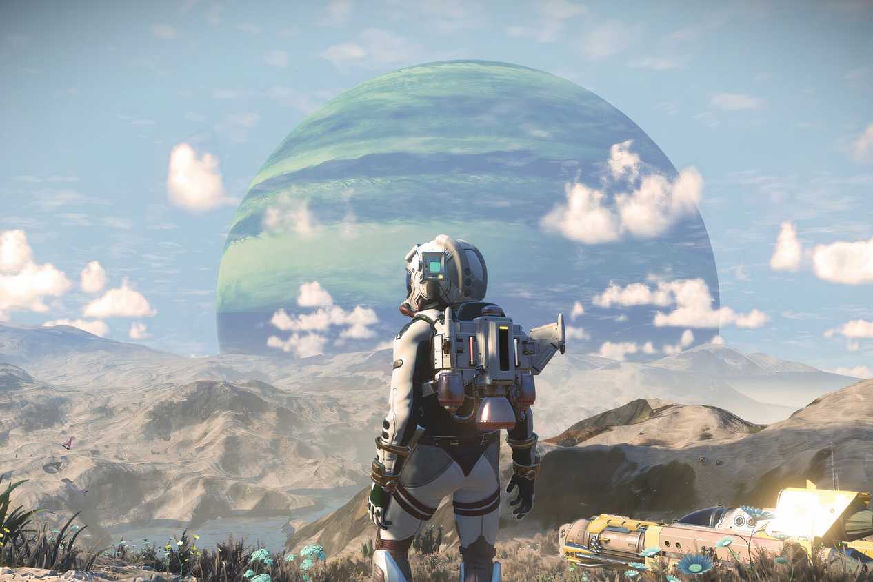 A person wearing a spacsuit look at an arid planet while another huge planet looms in the background.