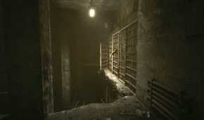 A screenshot from the game Outlast, showing prisoners sticking their hands out from bars.