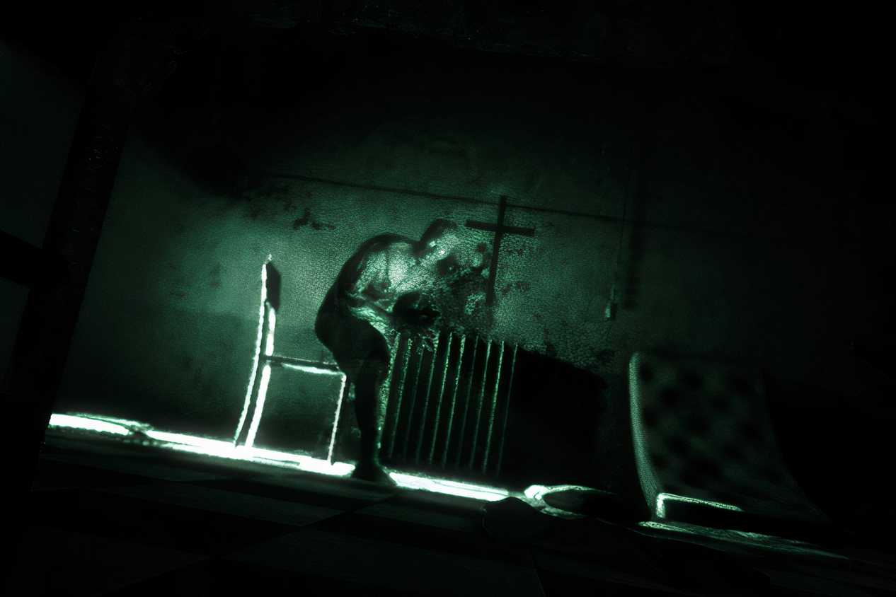 A screenshot from the game Outlast, showing a deranged peson in a nighvision filter.