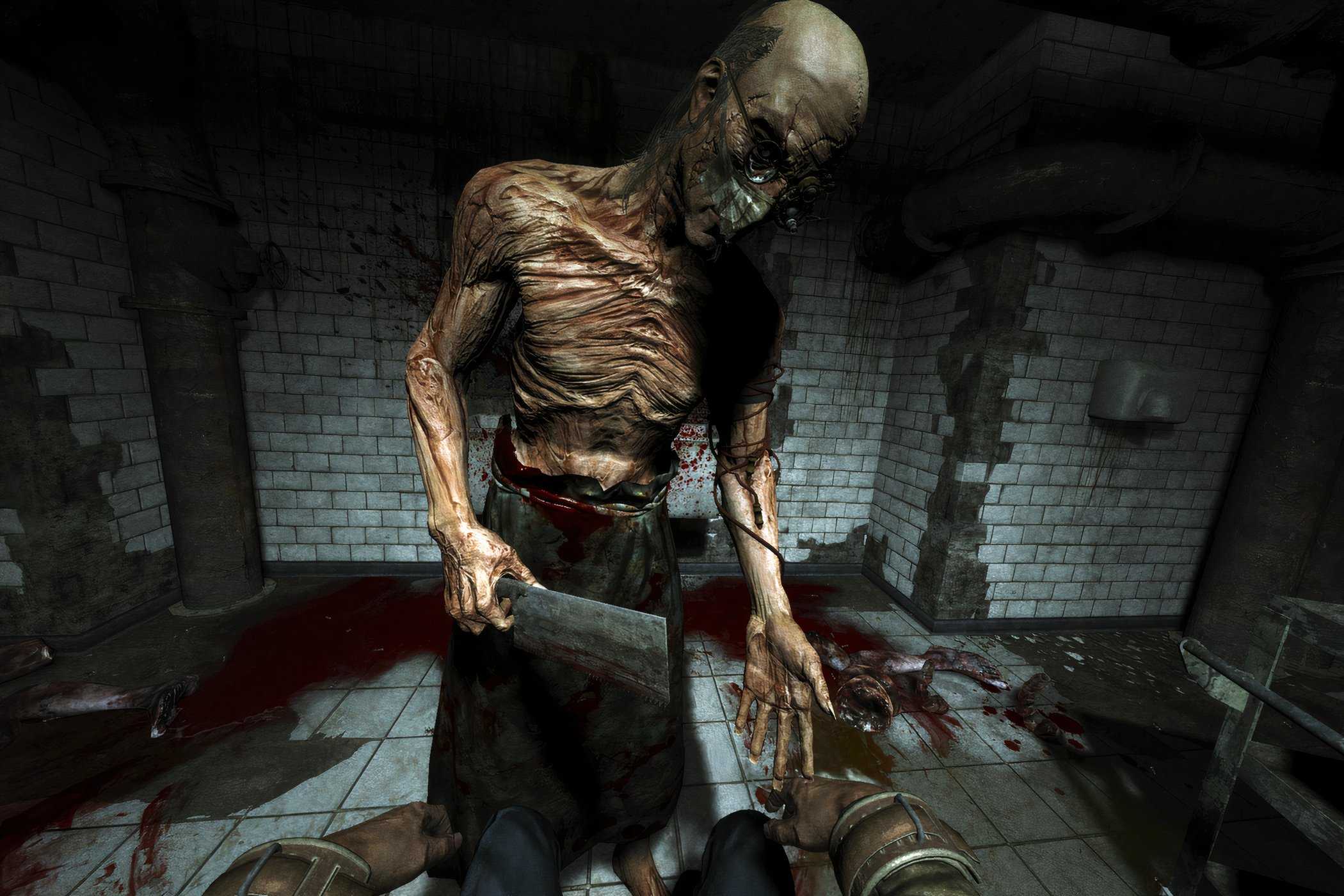 A screenshot from the game Outlast, showing a skeletal, grotesque person with a cleaver.