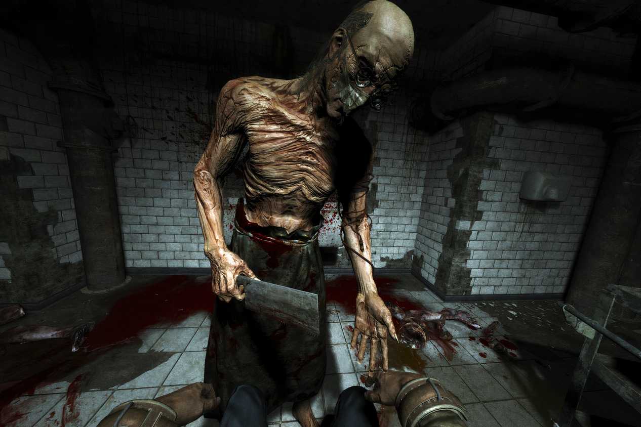 A screenshot from the game Outlast, showing a skeletal, grotesque person with a cleaver.