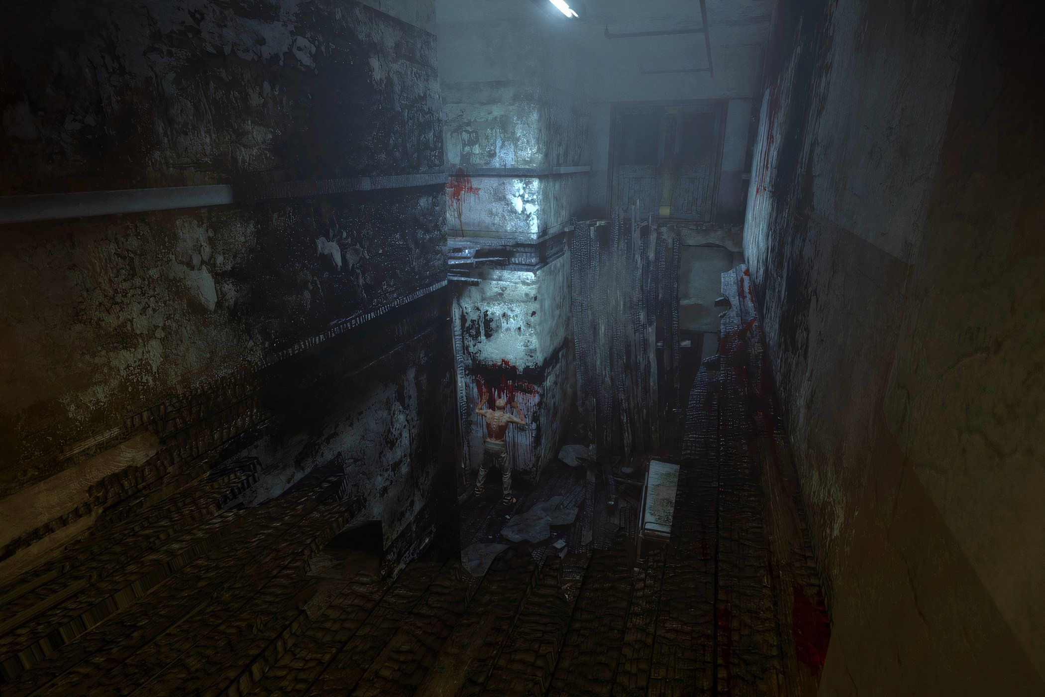 A screenshot from the game Outlast, showing a dark, dirty hallway.