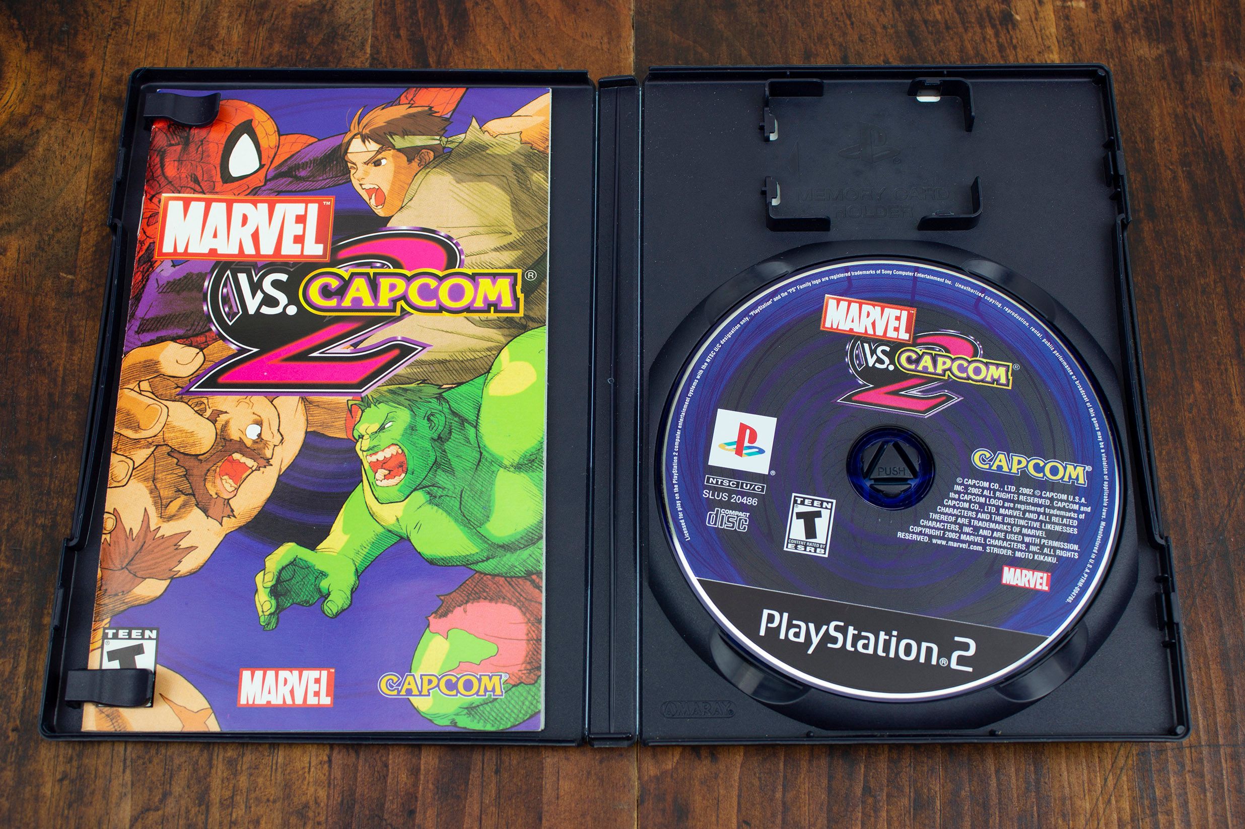 The box and disc for Marvel vs. Capcom 2 game on PS2