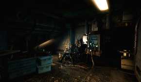 An image from the game "SOMA", showing a dimly-lit room with wires ripped out of the walls and a corpse.