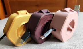 Three different cable organizers side by side