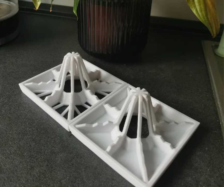 Two drying racks with flower pot behind