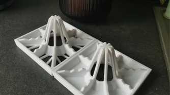 Two drying racks with flower pot behind
