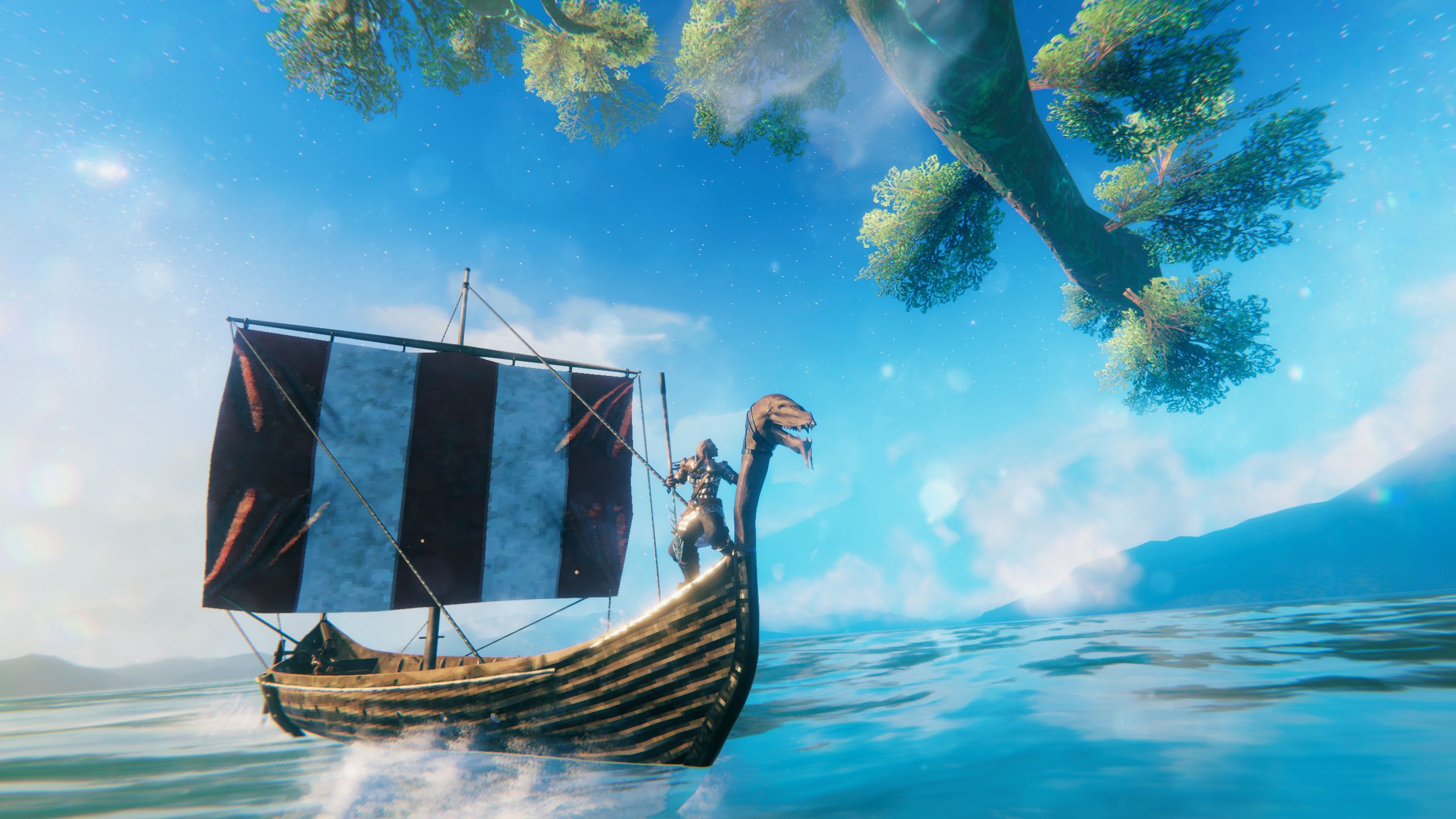 Screenshot from Valheim video game of Norse-style ship sailing on the sea with man standing at the edge of the ship