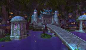 An image from the 2004 game World of Warcraft, showing a small manor atop a river with a bridge leading up to it.
