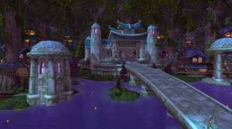 An image from the 2004 game World of Warcraft, showing a small manor atop a river with a bridge leading up to it.