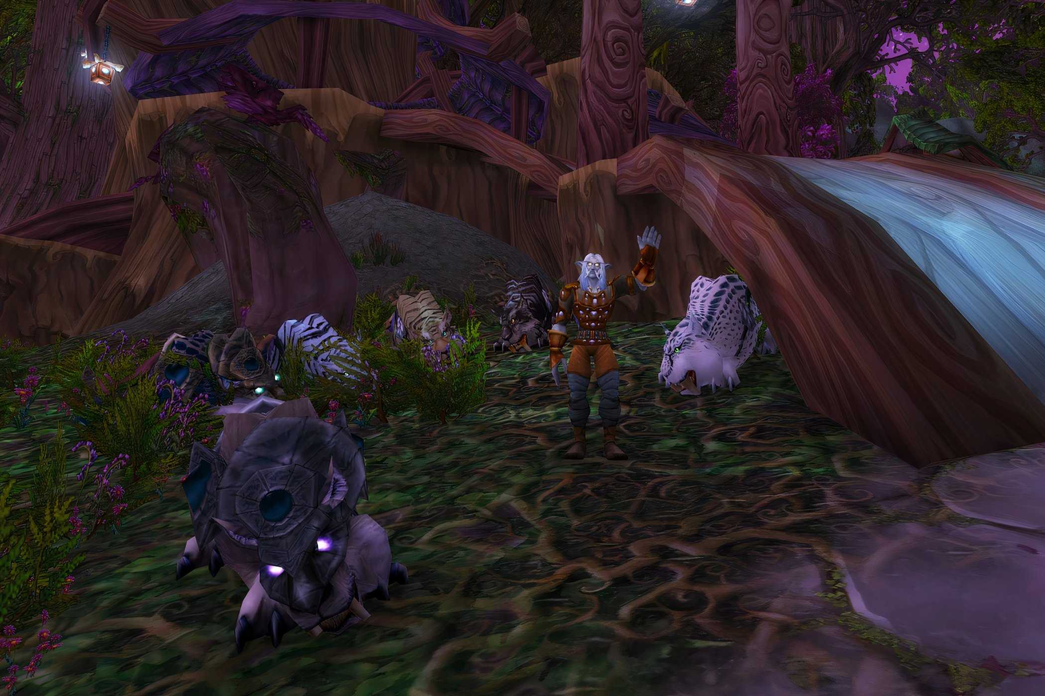 An image from the 2004 game World of Warcraft, showing a forest with huge trees in the night.