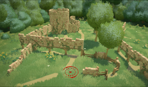 A ruined castle with overgrown vegetation