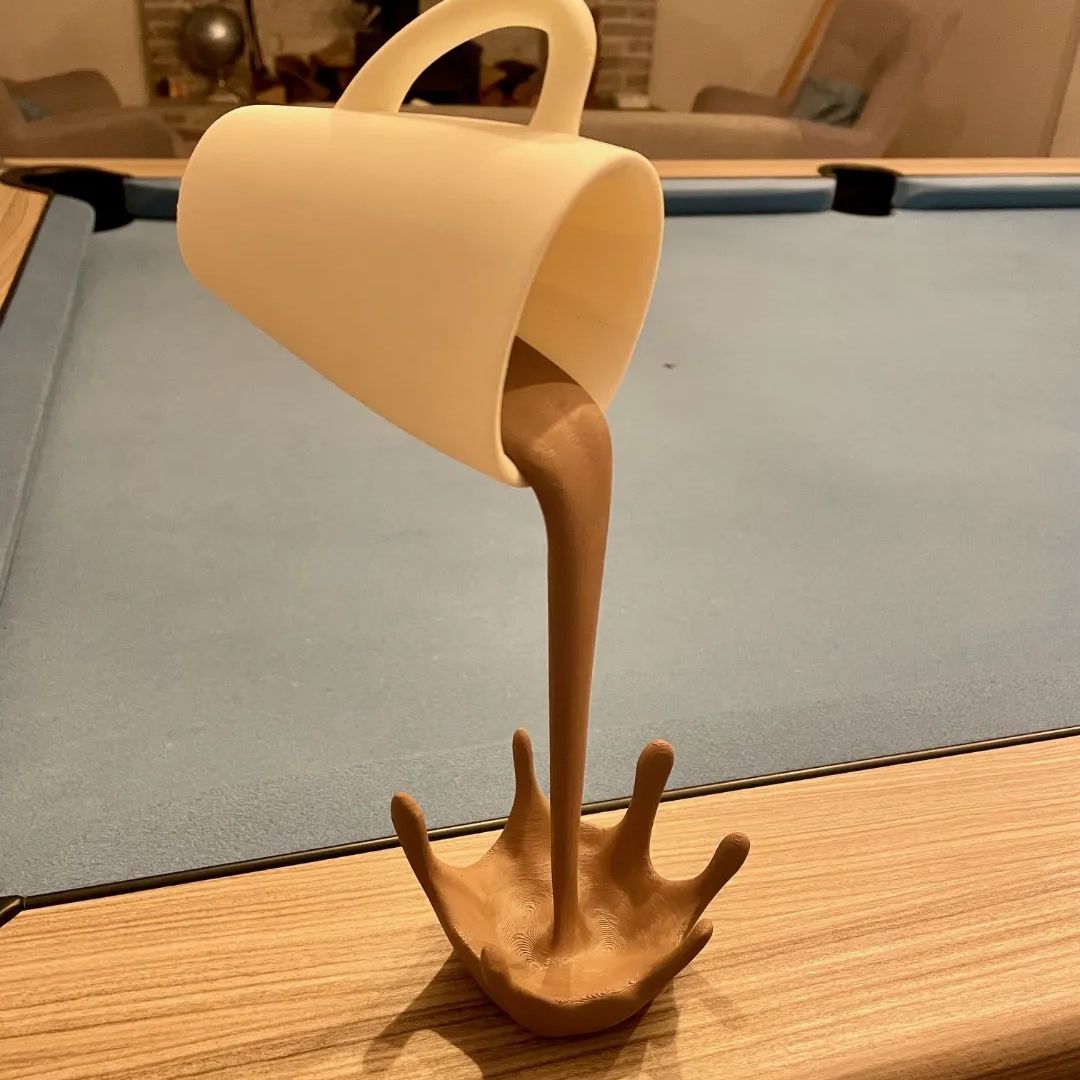 3D printed coffee splush sculpture in a well lit room