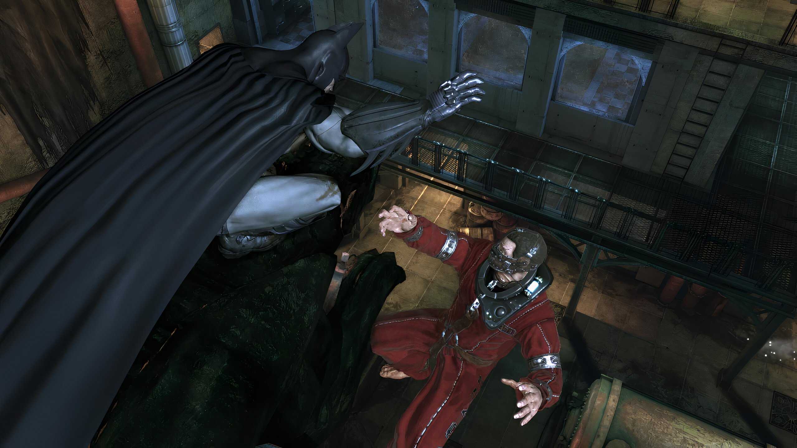 An image from the game Batman: Arkham Asylum, showing Batman taking down Firefly while seated atop a stone statue.