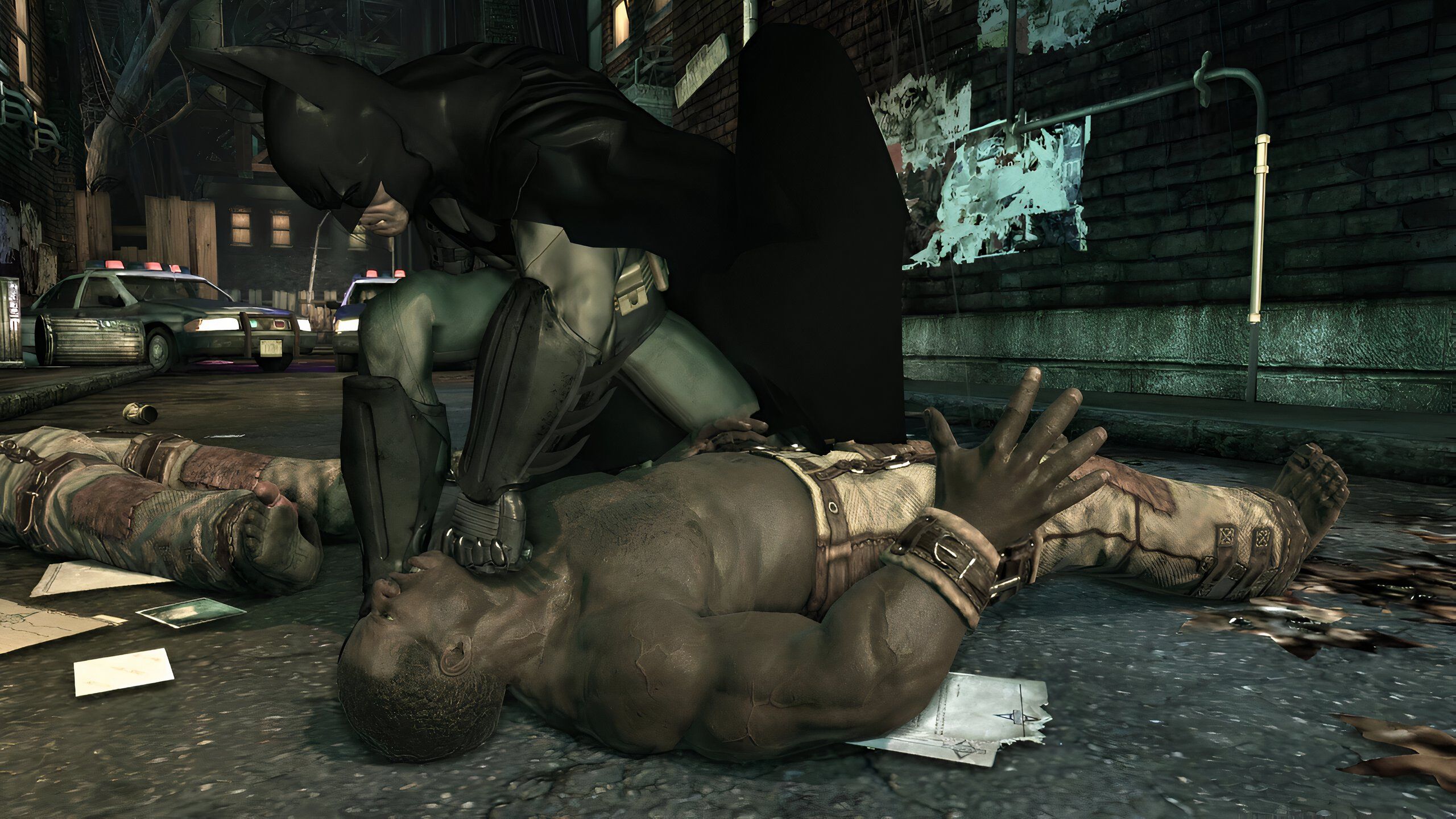 An image from the game Batman: Arkham Asylum, showing Batman sucker punching a prone thug.