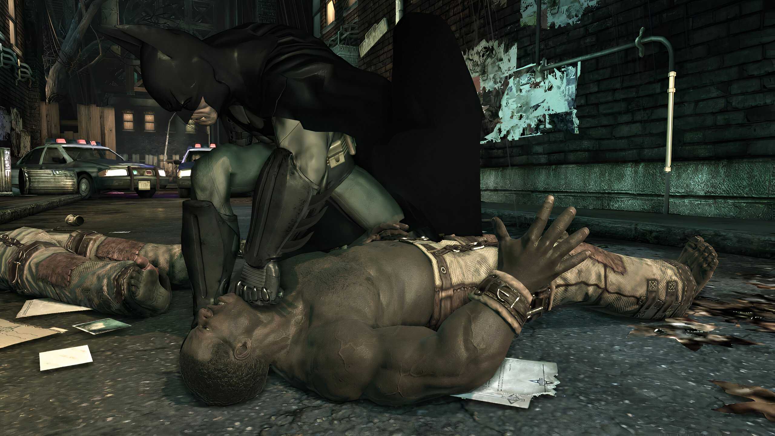 An image from the game Batman: Arkham Asylum, showing Batman sucker punching a prone thug.