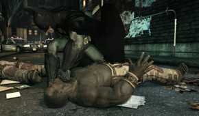 An image from the game Batman: Arkham Asylum, showing Batman sucker punching a prone thug.