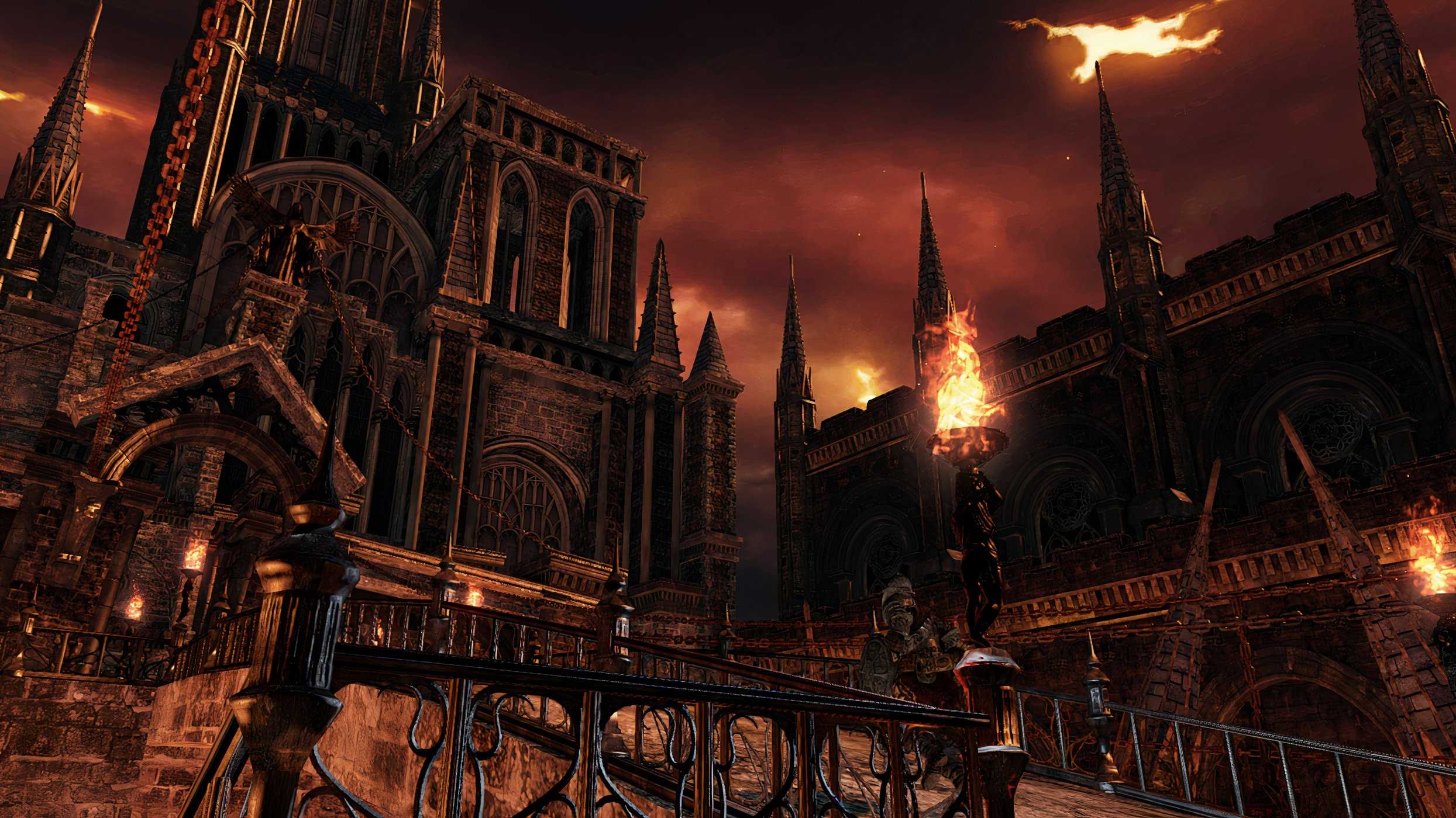 An image from Dark Souls 2, showing a huge castle under a fiery red sky.