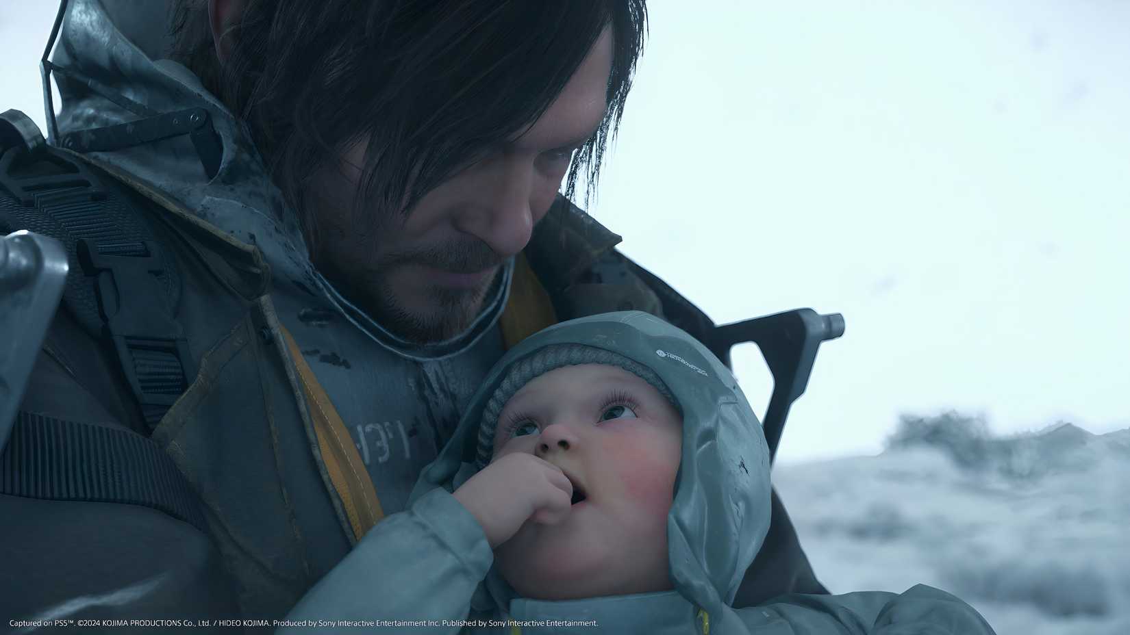 An image from the game Death Stranding 2: On The Beach, showing Sam and a baby.