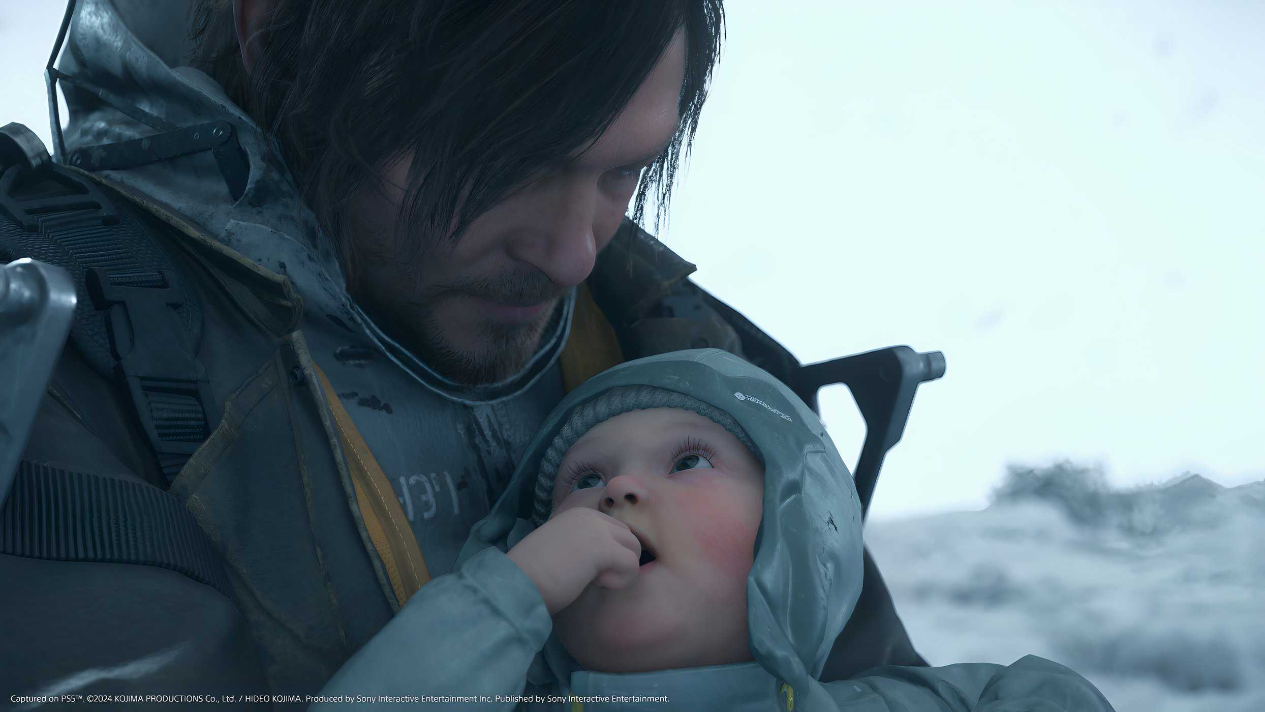 An image from the game Death Stranding 2: On The Beach, showing Sam and a baby.